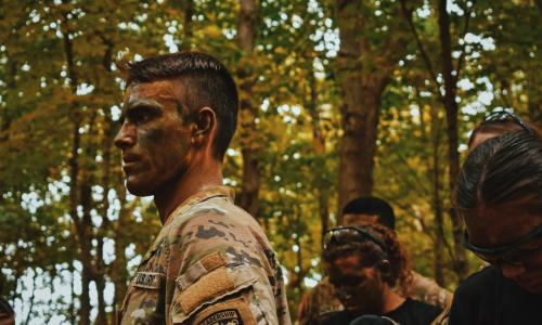 CDTs readying to rapel down a cliff