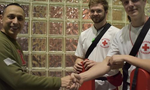PMS giving challenger coin to lifeguards